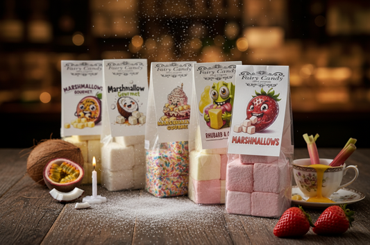 Assorted marshmallow packages on a wooden table with decorative items.